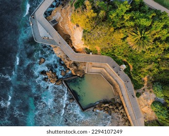 An aerial view of the boardwalk, ocean pool, and bay near Terrigal on the Central Coast of New South Wales, Australia 