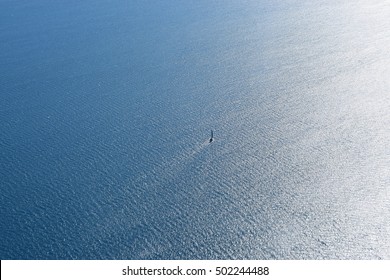 Aerial View Of A Boat In An Endless Ocean