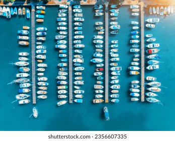 Aerial view of boats and luxure yachts in dock at sunset in summer in Krk island, Croatia. Colorful landscape with sailboats and motorboats in sea bay, jatty, clear blue sea. Top view of harbor - Powered by Shutterstock