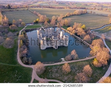 Aerial view of Bodiam Castle, 14th-century medieval fortress with moat and soaring towers in Robertsbridge, East Sussex, England.