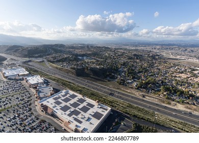 Aerial view of bog box stores and the 14 freeway in the Santa Clarita community of Los Angeles County, California. - Shutterstock ID 2246807789