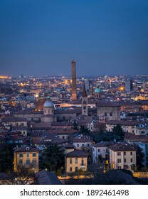 Aerial view of Bologna Cathedral and towers towering above of the roofs of Old Town in medieval city Bologna at night