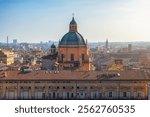 Aerial view of Bologna old town, Emilia Romagna, Italy with Palazzo dei Banchi with arched porticoes and Dome of the Basilica of San Pietro at sunrise. Travel destination in Europe