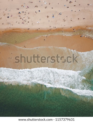 Similar – Luftaufnahme von fliegenden Drohnen von Menschen, die sich am Algarve Beach in Portugal entspannen.