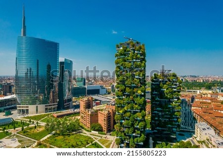 Aerial view of Bosco Verticale in Milan Porta Nuova district also known as Vertical forest buildings. Residential buildings with many trees and other plants in balconies