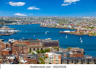 Aerial View Of The Boston Harbor And Waterfront On A Beautiful Sunny Day. Colorful, Bright Image With Blue Sky And White Clouds.