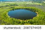 Aerial view of Bottomless  Lake in forest of Solnechnogorsk District, Moscow region. Russia. Aerial view. The lake is perfectly round and its depth is not determined.