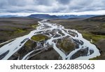Aerial view of braided glacial river with snow capped mountains, Kerlingarfjöll, Iceland