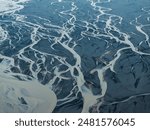 Aerial view of braided river patterns in Iceland.