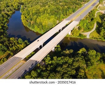 Aerial View Of Bridge  Over  River.  Ashburn Virginia.  Summer Landscape From Above View With Highway Road And Car Transportation