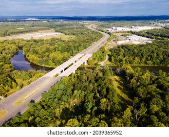 Aerial View Of Bridge  Over  River.  Ashburn Virginia.  Summer Landscape From Above View With Highway Road And Car Transportation