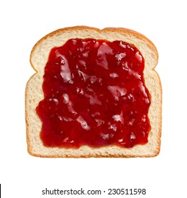 Aerial view of bright red strawberry preserves, spread over a slice of white bread.  - Powered by Shutterstock