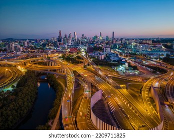Aerial view of Brisbane city and highway traffic in Australia at night