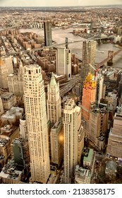 Aerial View Of Brooklyn And Manhattan Bridge At Sunset With East River And Downtown Manhattan Skyline