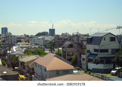 Aerial View Of Building And House Of Suburban Area In Japan With Clouds In Blue Sunny Sky Background. No People.