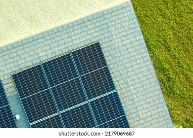 Aerial View Building Roof With Rows Of Blue Solar Photovoltaic Panels For Producing Clean Ecological Electric Energy. Renewable Electricity With Zero Emission Concept