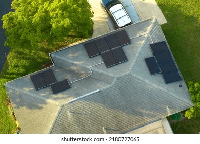 Aerial View Building Roof With Rows Of Blue Solar Photovoltaic Panels For Producing Clean Ecological Electric Energy. Renewable Electricity With Zero Emission Concept