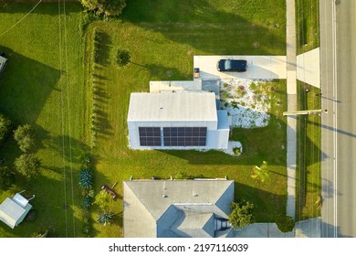 Aerial View Building Roof With Rows Of Blue Solar Photovoltaic Panels For Producing Clean Ecological Electric Energy. Renewable Electricity With Zero Emission Concept