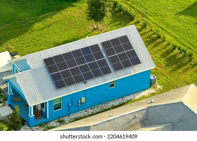 Aerial View Building Roof With Rows Of Blue Solar Photovoltaic Panels For Producing Clean Ecological Electric Energy. Renewable Electricity With Zero Emission Concept