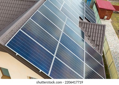 Aerial View Building Roof With Rows Of Blue Solar Photovoltaic Panels For Producing Clean Ecological Electric Energy. Renewable Electricity With Zero Emission Concept