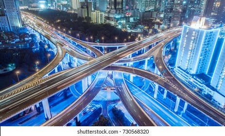 Aerial View Of Buildings And Highway Interchange At Night In Shanghai City