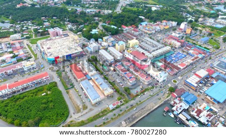 An aerial view of buildings and sea of Lahad Datu, Sabah. Borneo. Lahad Datu District in capital of the Tawau Division, Sabah. The town is surrounded by stretches of cocoa and palm oil plantations.