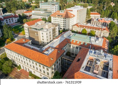 Aerial view of buildings in University of California, Berkeley campus on a sunny autumn day, San Francisco bay area, California; the shadow of Campanile tower visible in the photo
