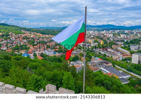 Aerial view of Bulgarian town Pernik and Bulgarian flag
