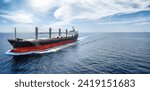 Aerial view of a bulk carrier cargo vessel traveling with high speed over blue sea with copy space as a concept for import and export industry