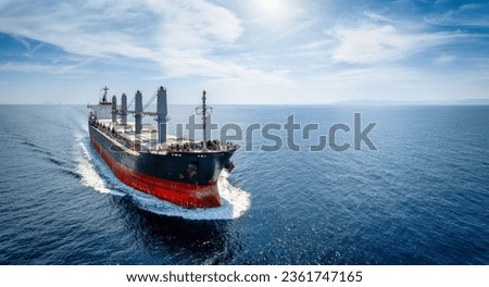 Aerial view of a bulk carrier cargo vessel traveling with high speed over blue sea Stock foto © 