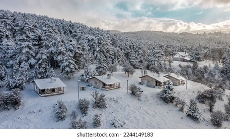 
				aerial view of bungalow houses in snowy weather