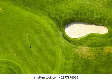 Aerial View Of Bunkers Sand In Golf Court With Putting Green Grass.