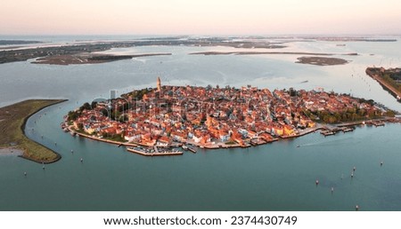Aerial view of Burano Island at sunset golden hour, Venice, Italy