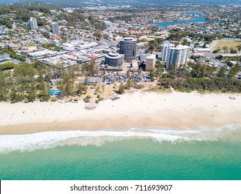 An aerial view of Burleigh Heads on a clear day with blue water