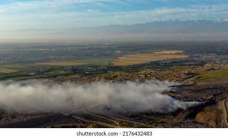 Aerial View Of Burning Garbage Piles In Trash Landfill