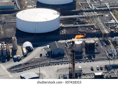 Aerial View Of A Burning Oil & Gas Refinery Flare Stack