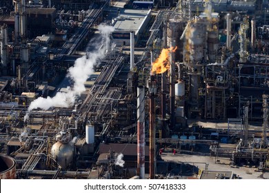 Aerial View Of A Burning Oil & Gas Refinery Flare Stack