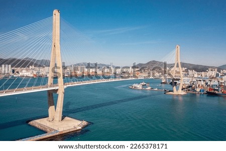 Aerial view of Busan Harbor Bridge on a sunny day