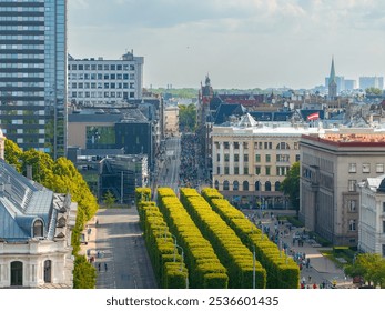 Aerial view of bustling Riga street during Rimi Marathon 2024. Participants and spectators fill the streets, with modern and historical buildings and a church spire visible. - Powered by Shutterstock