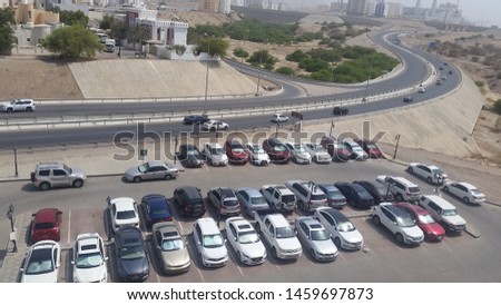 Aerial view of a busy car parking in a desert city
