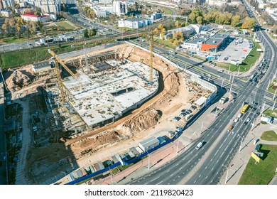 Aerial View Of Busy Construction Site In City. New Commercial Building Under Construction.