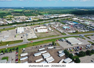 An Aerial View Of Busy Expressway And Truck Stop