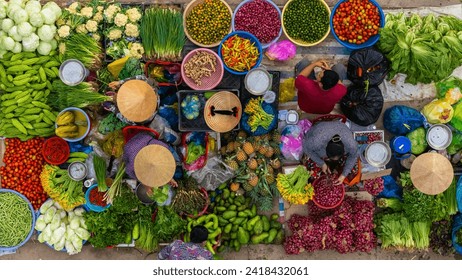 Aerial view of busy local daily life of the morning local market in Vi Thanh or Chom Hom market, Vietnam. People can seen exploring around the market. - Powered by Shutterstock