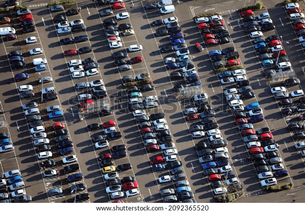aerial view of a busy retail park car park or\
parking lot in the run up to\
Christmas