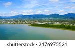 Aerial view of the Cairns waterfront as seen from a helicopter flying above the Coral Sea in northern Queensland, Australia