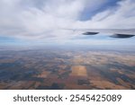 Aerial View of Calgary City and Vast Fields in Alberta, Canada from an Airplane Window