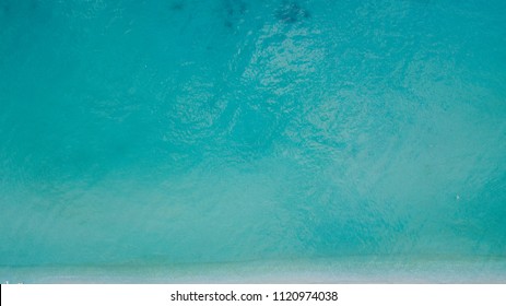 Aerial View Of Calm Sea Water. Top View Of A Clean Ocean Water Near A Coast.