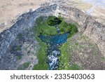 Aerial view of the canyon and turquoise-colored river in the Box canyon state park. Shot near Twin Falls, Idaho state, USA.