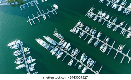 Aerial view captures serenity of multiple yachts docked along semicircular Marina in Mazatlan, offering a glimpse into a luxurious coastal retreat under the azure sky - Powered by Shutterstock