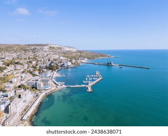 Aerial view capturing the vibrant coastal life with a marina, cliffside houses, and a cargo port - Powered by Shutterstock